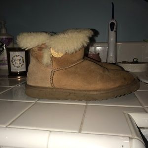 Used short button ugg boots